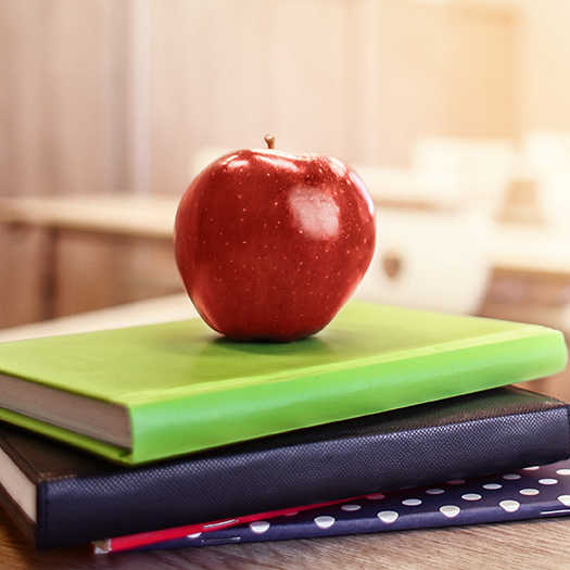 apple on teachers desk